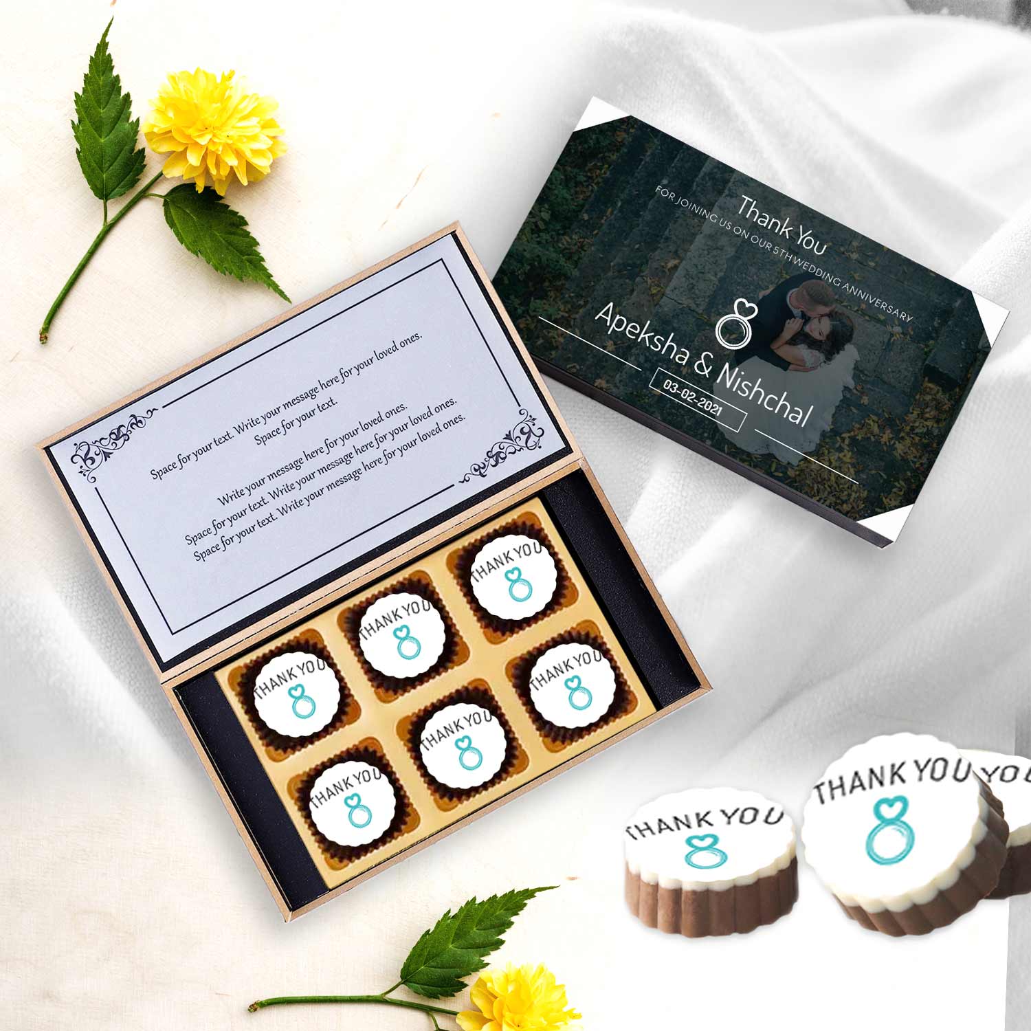 Elegant white anniversary return gift chocolates
