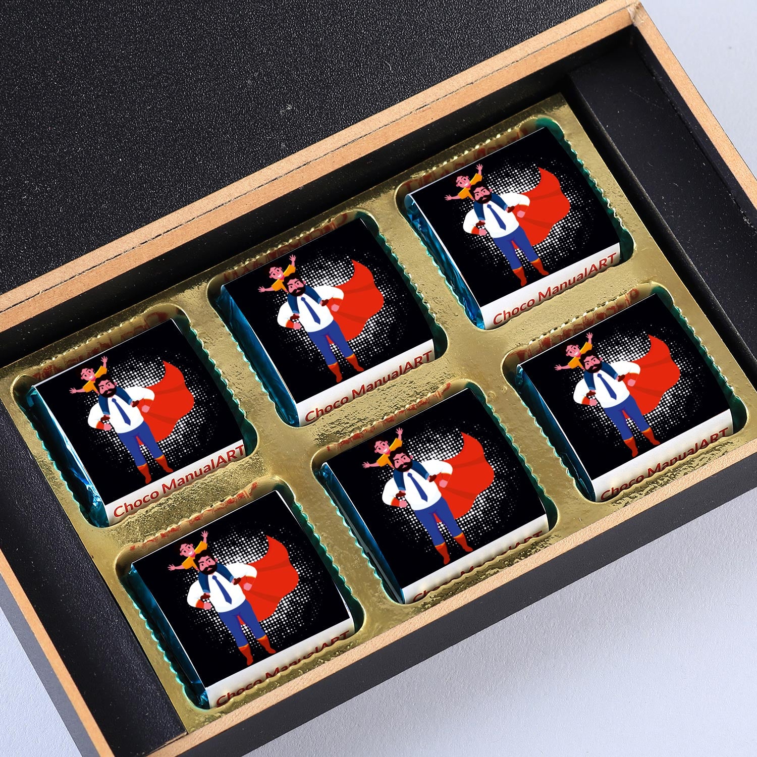 customized black wooden box with all wrapper printed chocolates. There is also a personalized message printed on Message paper inside the box.