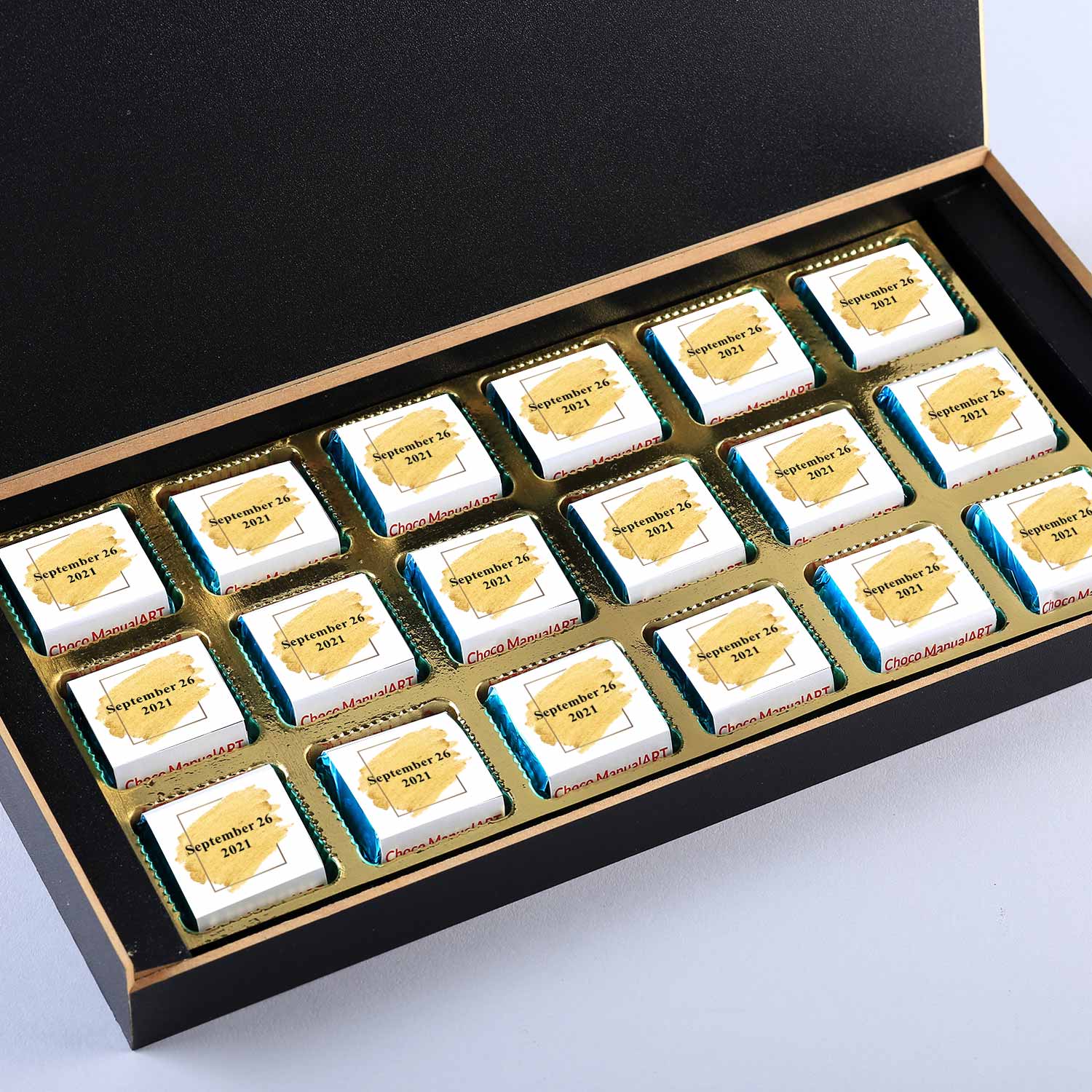 Customized black wooden box with all wrapper printed chocolates. There is also a personalized message printed on Message paper inside the box..
